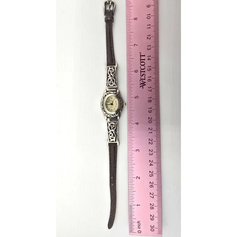 Woman's Geneva Silver Tone Oval Quartz Watch Ornate Bracelet Silver Tone